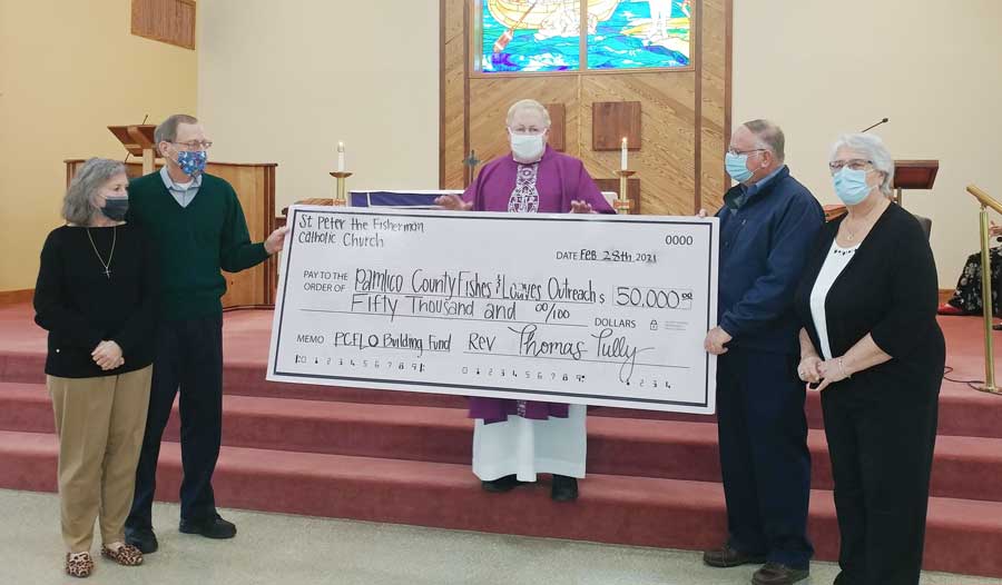 Rev. Thomas Tully of St. Peter the Fisherman Catholic Church presents a check to PCFLO for $50,000 as a donation for the group’s building fund. From left: Paula Valinoti, Parish Council Chairperson; Ray Ruppert, PCFLO Chairperson; Rev. Thomas Tully; Bill Miles, PCFLO Past Chairperson and Project Manager; and, Eileen Miles, PCFLO, Asst. Project Manager