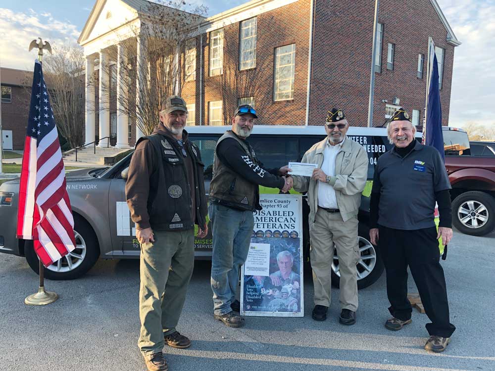 left to right Bam Bam and Magoo from the Iron Horsemen presenting a check to Jr. Vice Commander Ray Barnes and Commander Larry Summers of the Pamlico County DAV