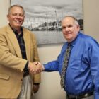 Bill Fentress (left) receives congratulations from Tim Buck, County Manager.