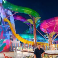 The father-son duo acted like guests some of the time, with early access to spectacular Icon of the Seas amusements like this colorful, convoluted water park.